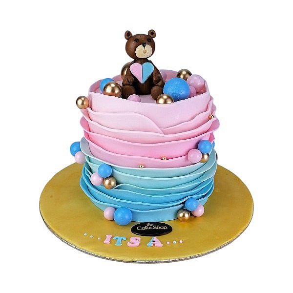 A teddy bear-themed gender reveal cake