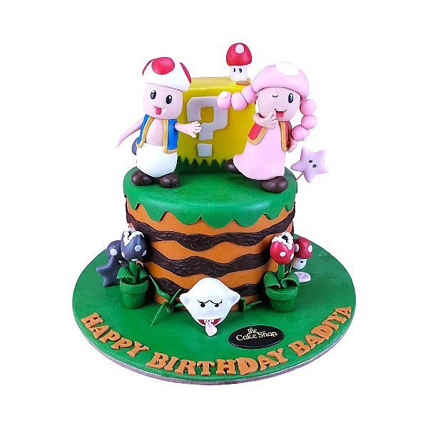 Cake with dolls on it